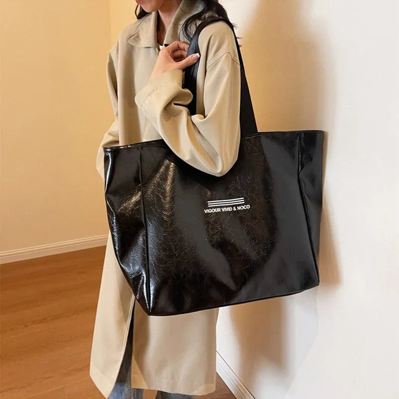 Large capacity PU tote bag for women in solid black, beige or brown, waterproof shoulder handbag for daily and travel use.