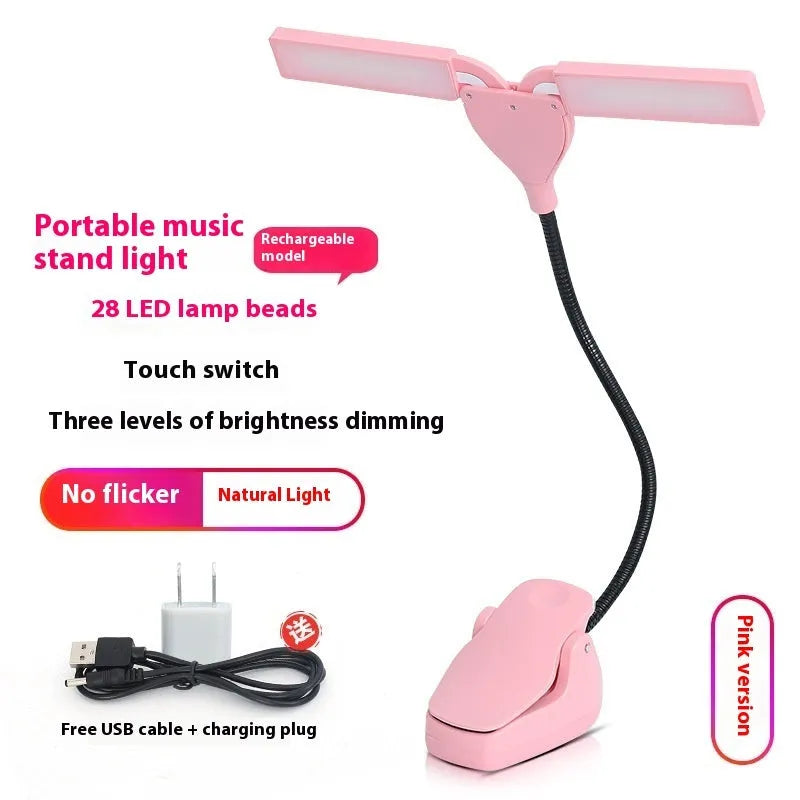 Black USB rechargeable music stand lamp with 28 LEDs clipped to a metal stand.