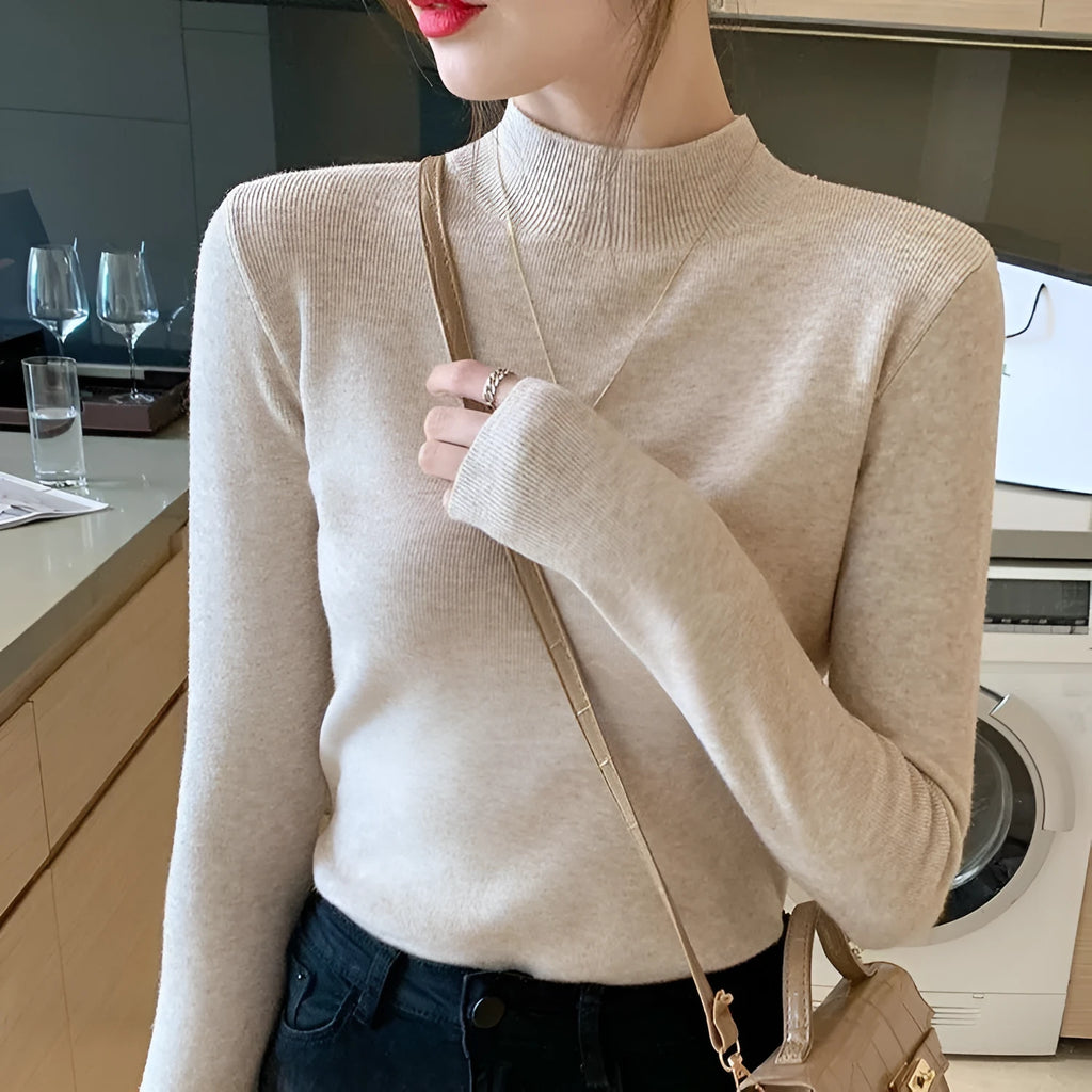Women's slim fit knitted long sleeve shirt in viscose, shown in apricot colour.