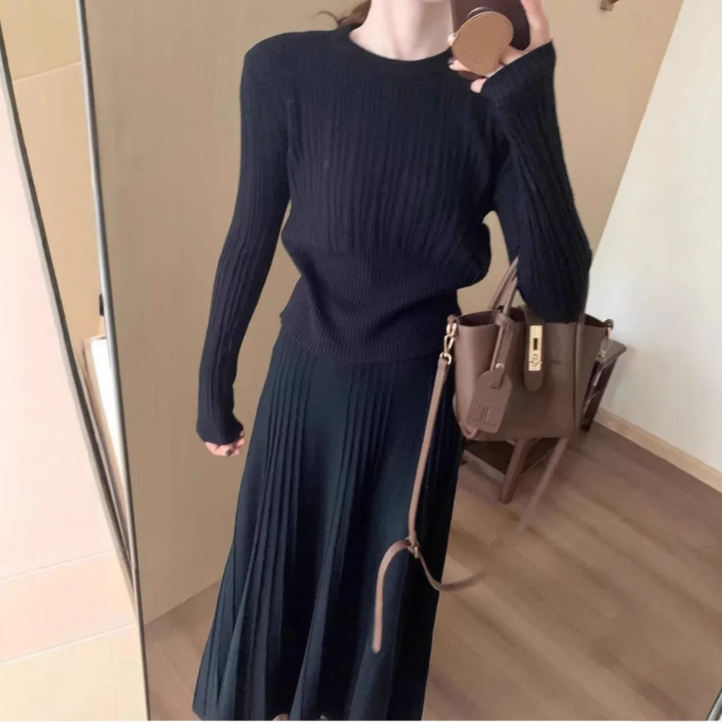 Dark grey knitted two-piece dress suit with 3D texture, featuring a sweater and skirt in artistic retro style.
