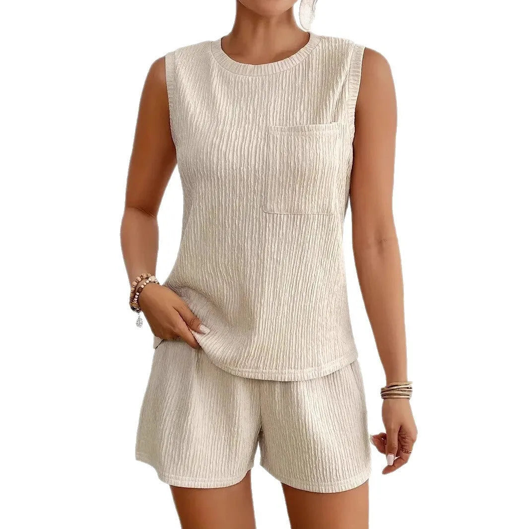 Women's apricot coloured sleeveless vest and matching shorts lounge set on a hanger.