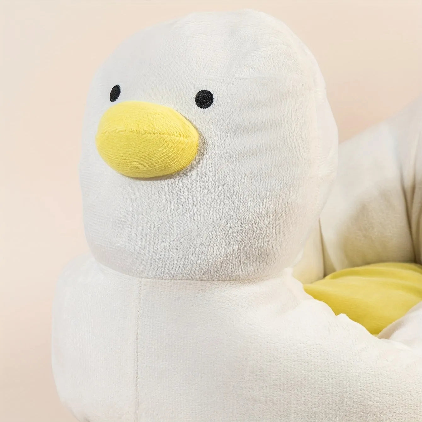 Blue duck-shaped fluffy pet bed for a small dog, showing raised rim and soft material.