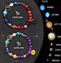Set of twelve natural stone beaded bracelets, each with a different antique-finished zodiac sign charm on an adjustable chain.
