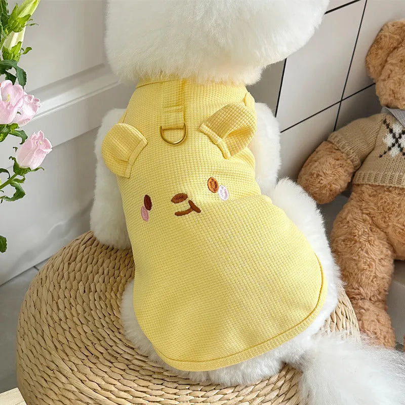 Yellow waffle fabric dog vest on a small dog, showing casual style and fit.