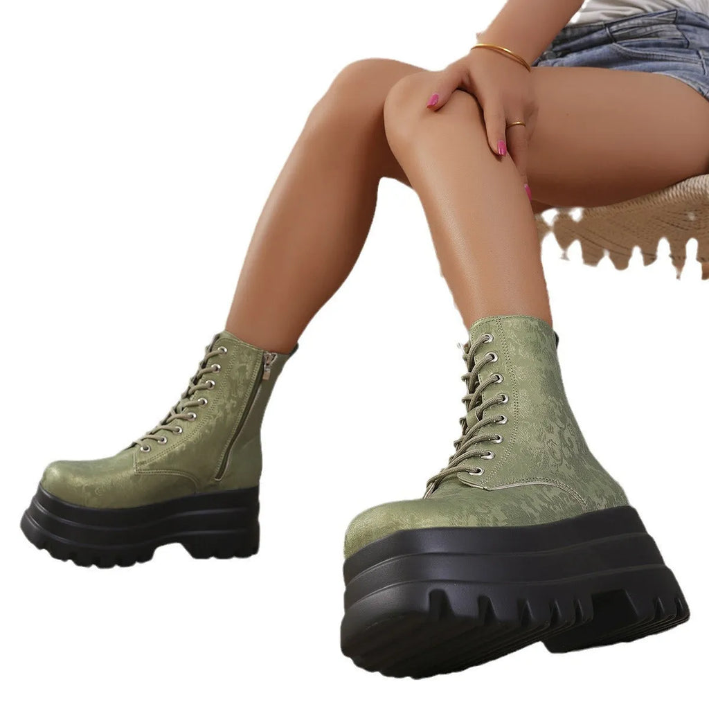 Women's black retro platform Martin boots with chunky heel and side zipper on a three-layer sole