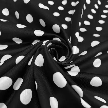 Multicolour polka dot midi dress with a structured square neckline and a front metal zipper closure.