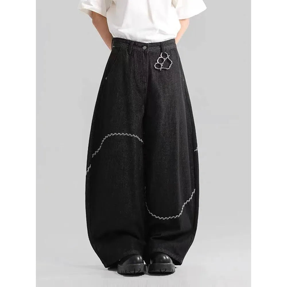 Black men's straight-leg denim trousers with a mid-rise waist and zip fly.