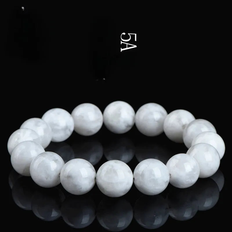 Women's bracelet with round blizzard snowflake crystal beads in geometric shapes on a wrist.