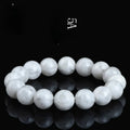 Women's bracelet with round blizzard snowflake crystal beads in geometric shapes on a wrist.
