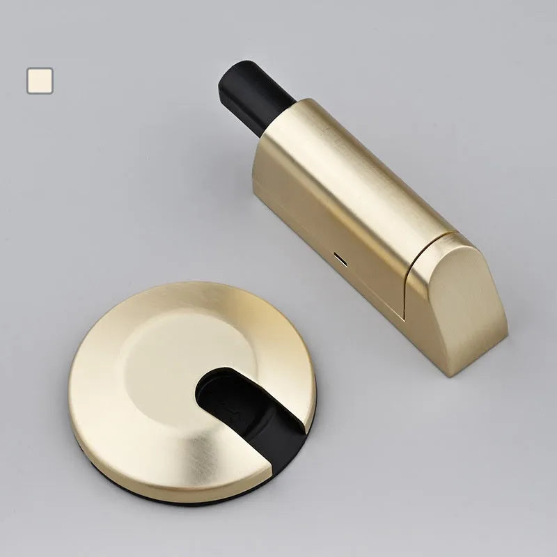 Invisible zinc alloy door stopper in brushed nickel finish for modern bedrooms.