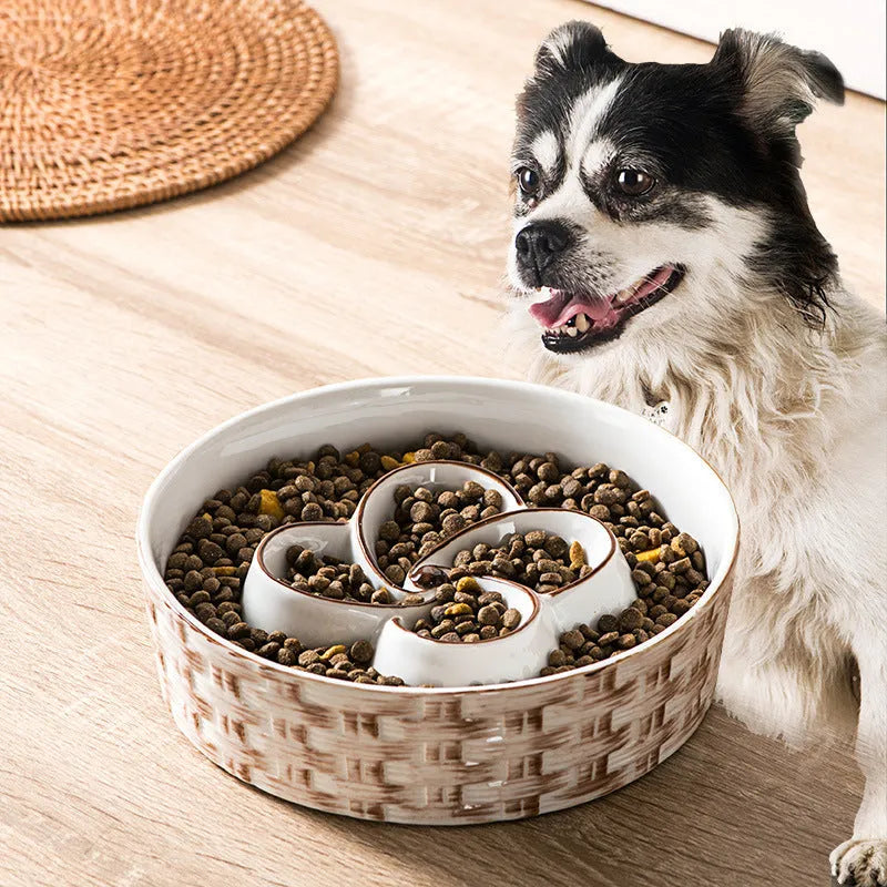 Ceramic slow feeder dog bowl with raised ridges in blue colour on a floor