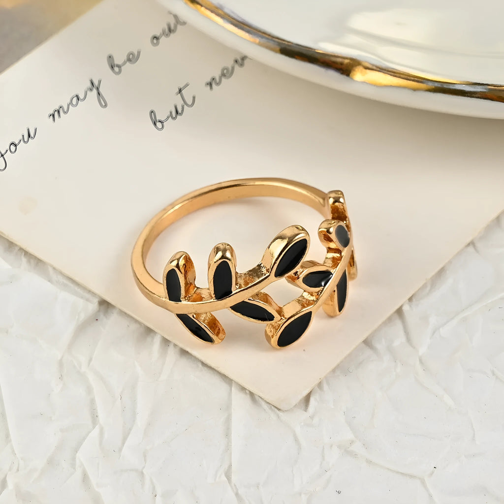 Gold geometric leaf design finger ring with floral elements and electroplated finish
