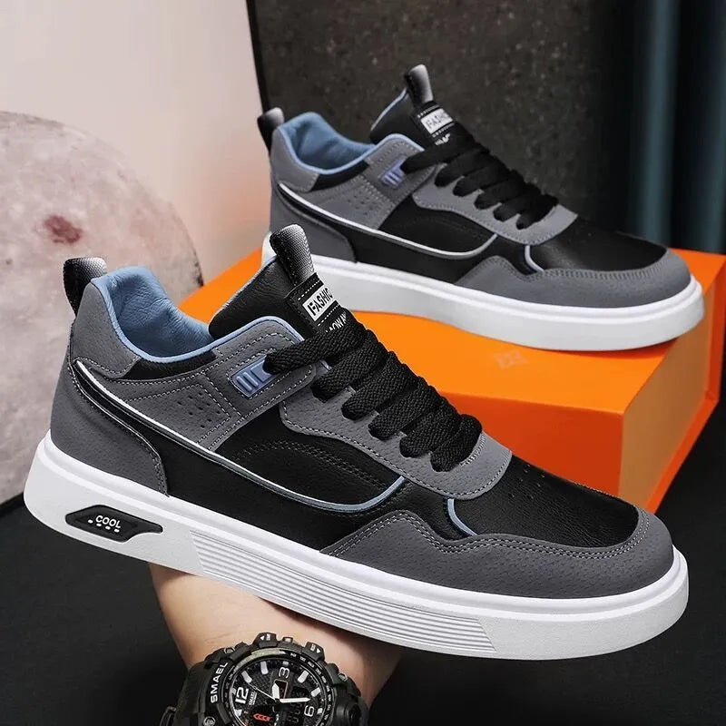 Men's low-top casual canvas shoes in beige with leather stitching detail on a white background.