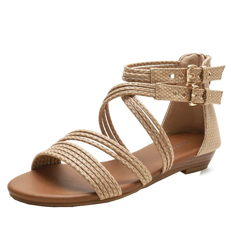 Women's open-toe Roman sandals with cross-strap design, wedge heel, and back zipper in light green.