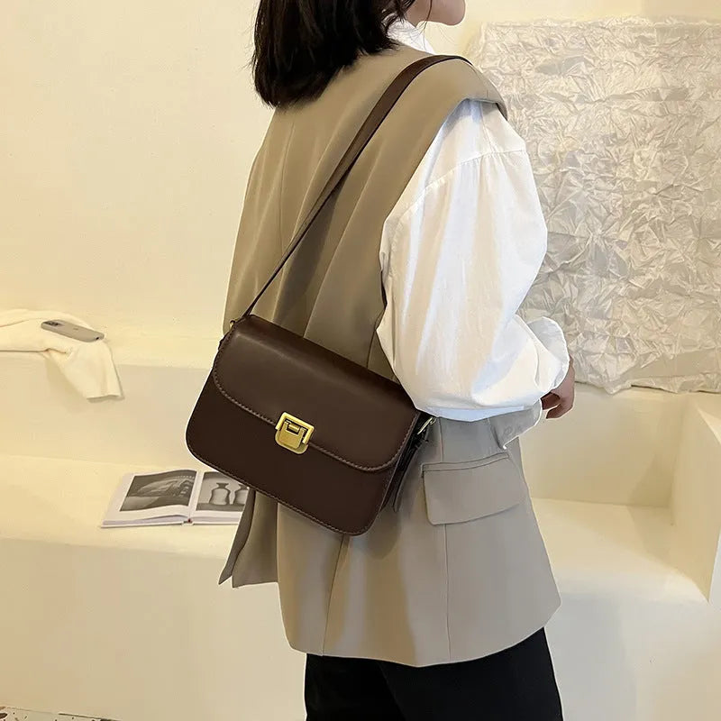 Soft black PU leather women's small square cross-body bag with a shoulder strap