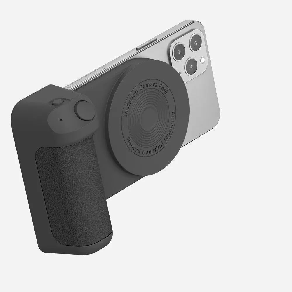Black magnetic phone camera holder with rotatable bracket and ergonomic leather handle on a table.
