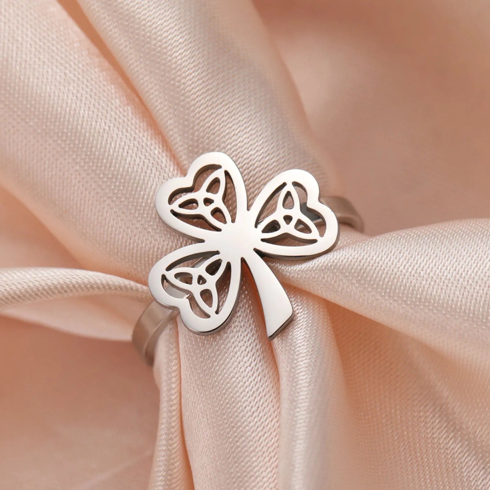 Stainless steel hollow ring shown in gold and steel colour finishes on hand