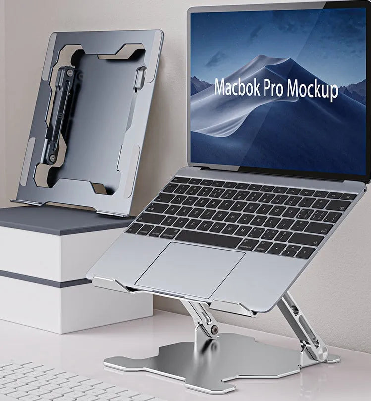 Grey aluminium adjustable and foldable laptop stand on a wooden desk.