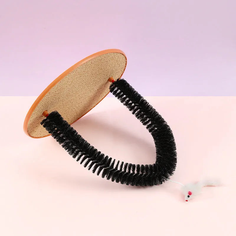 Black arch-shaped cat grooming brush with scratching surface and attached plush mouse toy on non-slip base