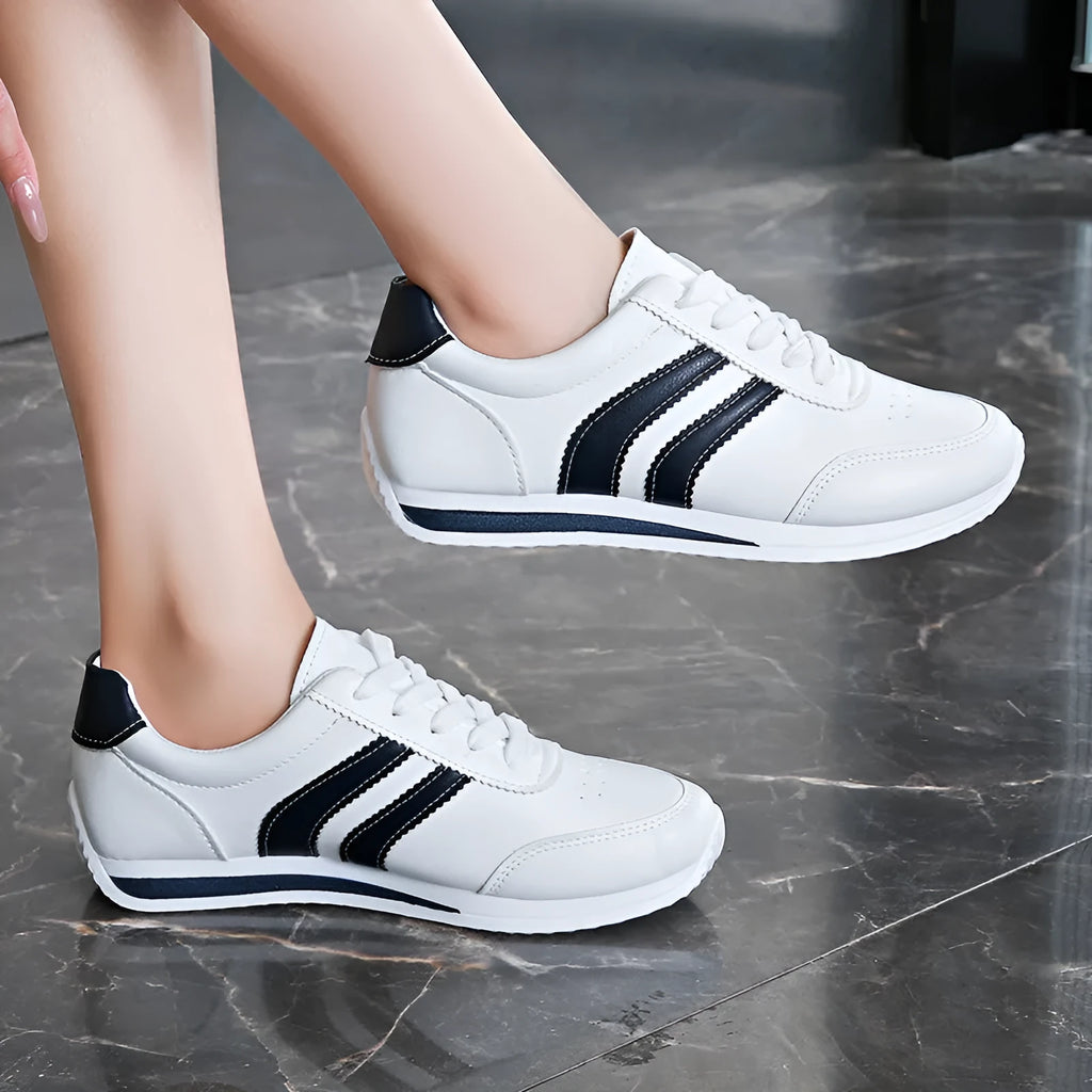 Blue casual lace up soft bottom sneaker with rubber sole and round toe, low top design