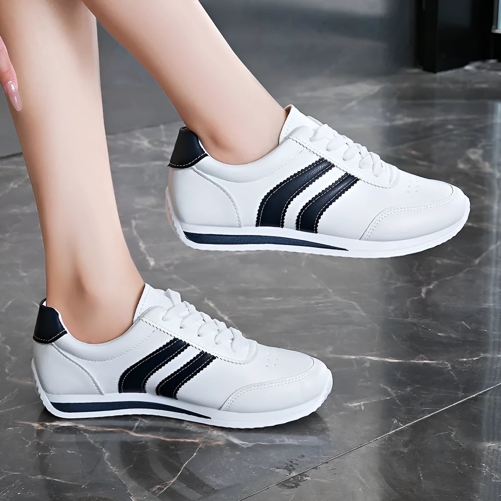 Blue casual lace up soft bottom sneaker with rubber sole and round toe, low top design