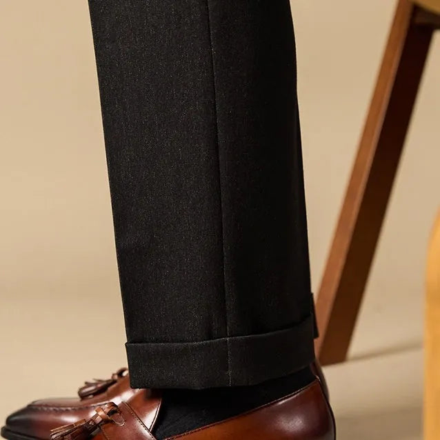 Men's polished leather tassel loafers in black and brown with pigskin lining and rubber sole