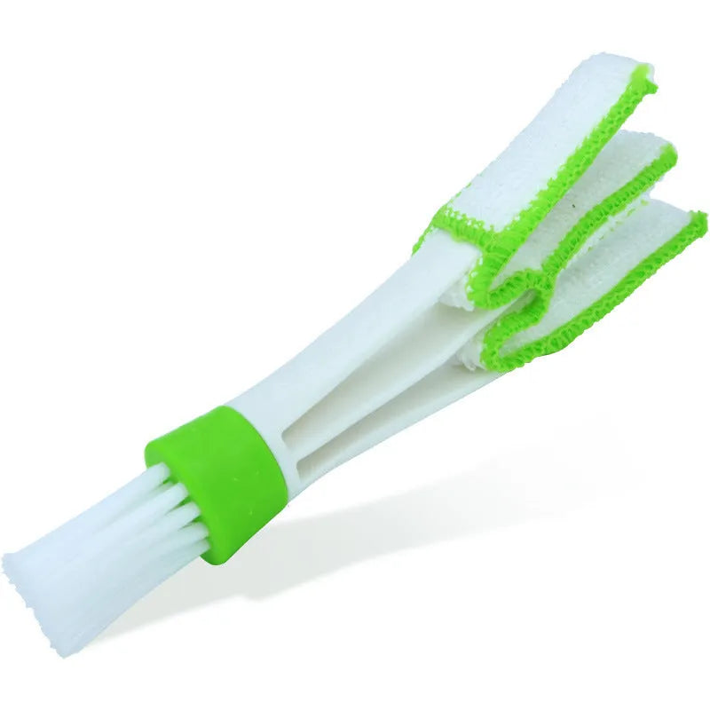 Multi functional double head gap brush for air conditioner slatted vent cleaning with green handle and superfine fibre bristles on white background