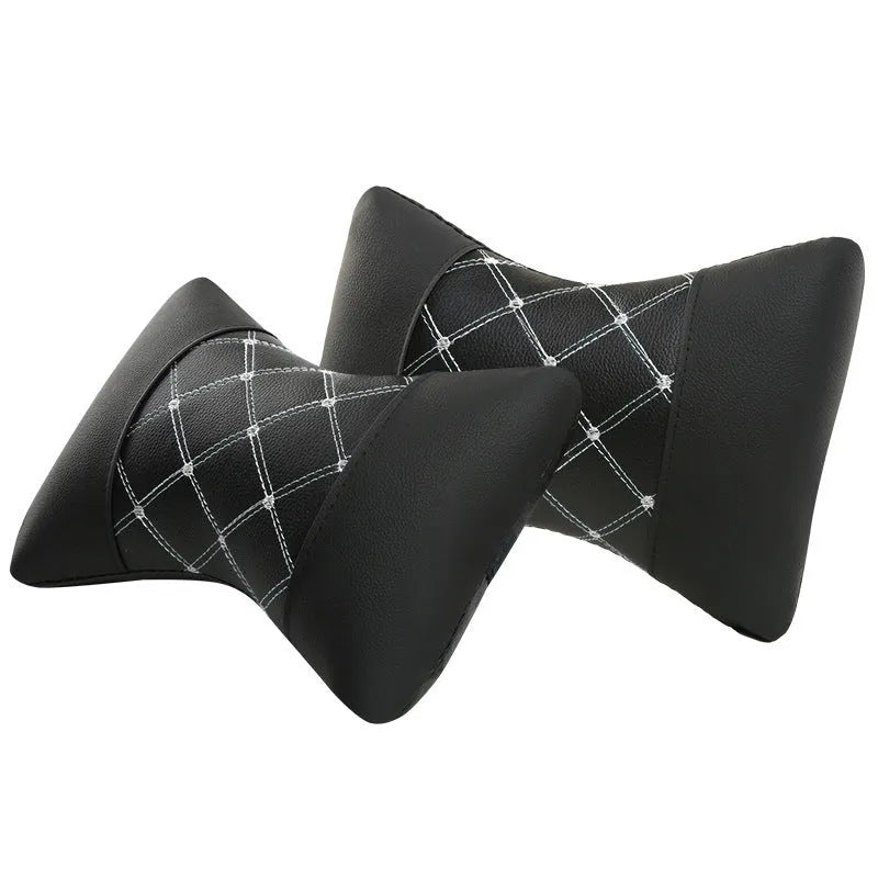 Black quilted artificial leather car headrest cover with coloured stitching lines.