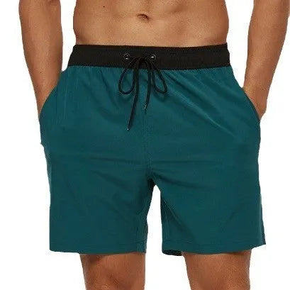Men's blue drawstring athletic shorts with a stitching waistband and zipper pocket.