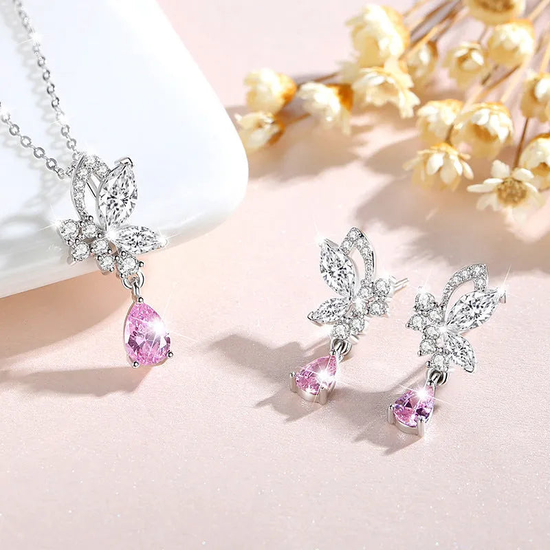 Women's sterling silver butterfly stud earrings with crystal accents on white background