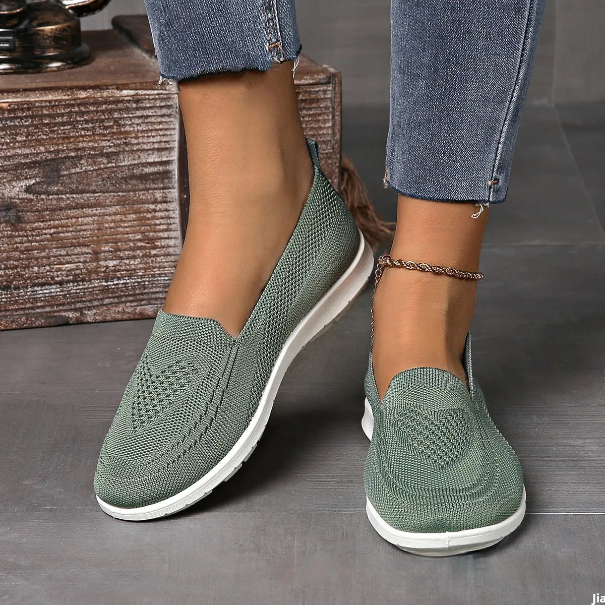 Women's plus size beige slip-on loafers with heart pattern and mesh lining.