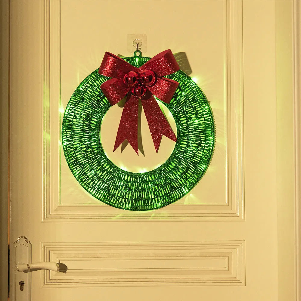 50cm gold and green Christmas garland with LED lights and bowknot on a door