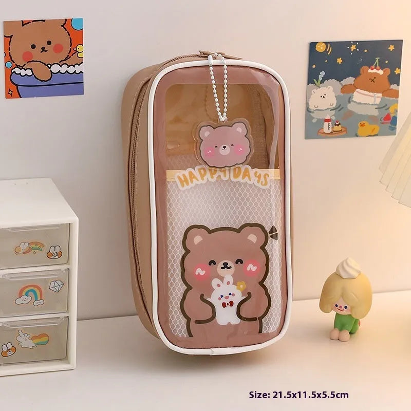 Transparent PVC student pencil case with Korean-style cartoon design showing stationery storage capacity