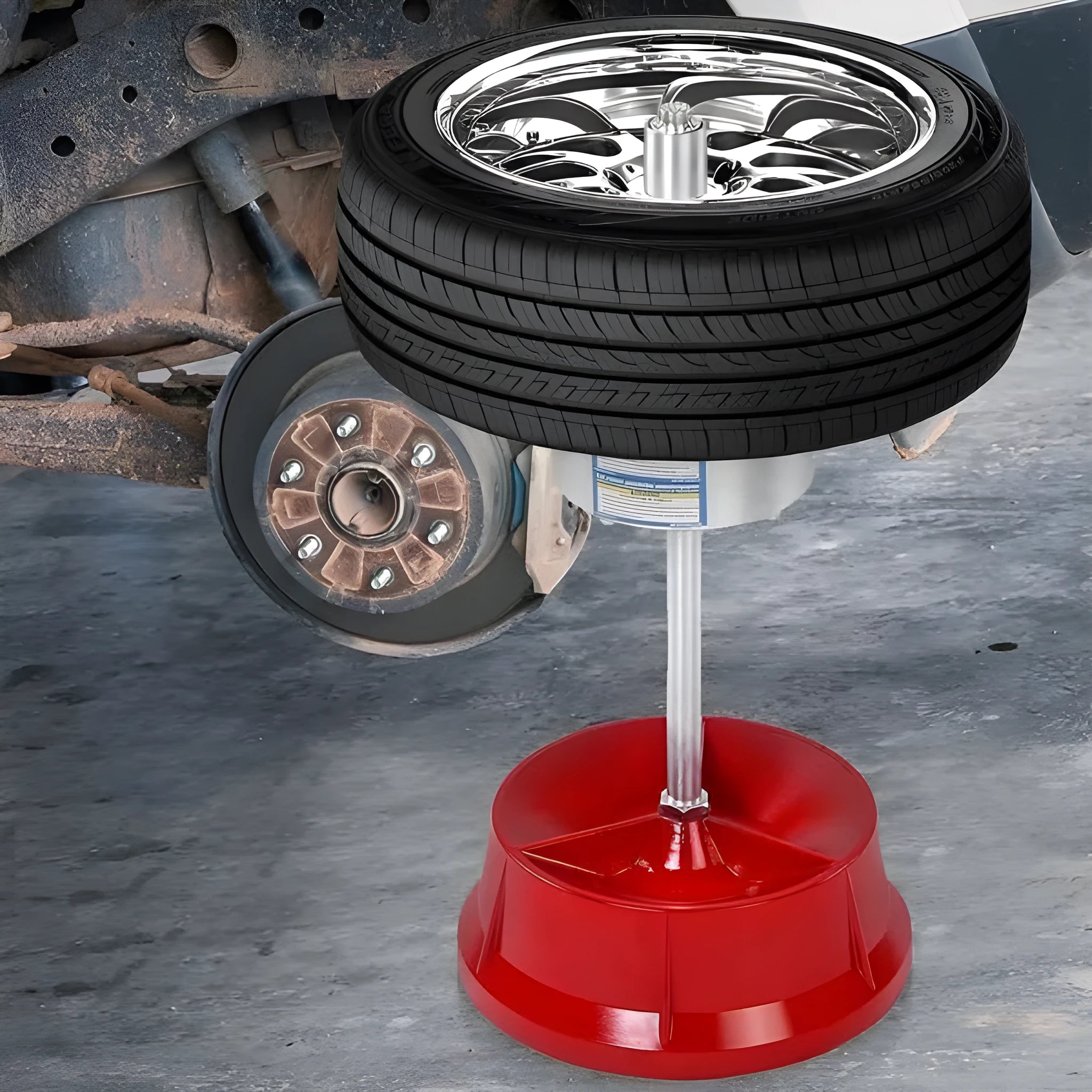 Portable aluminium hub balancer with bull's eye level on an enamel-finished base for tyre balancing.