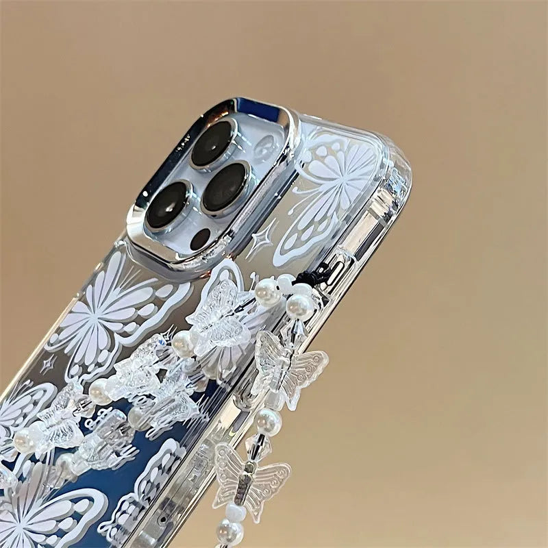 Transparent iPhone 15 Pro Max case with integrated mirror and bow decoration on back