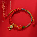 Red cinnabar bracelet with geometric patterns and peace buckle closure