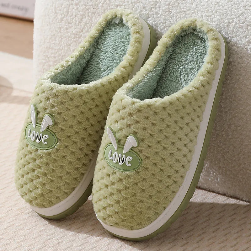 Rabbit plaid design women's plush slippers with anti-slip rubber soles in apricot colour.