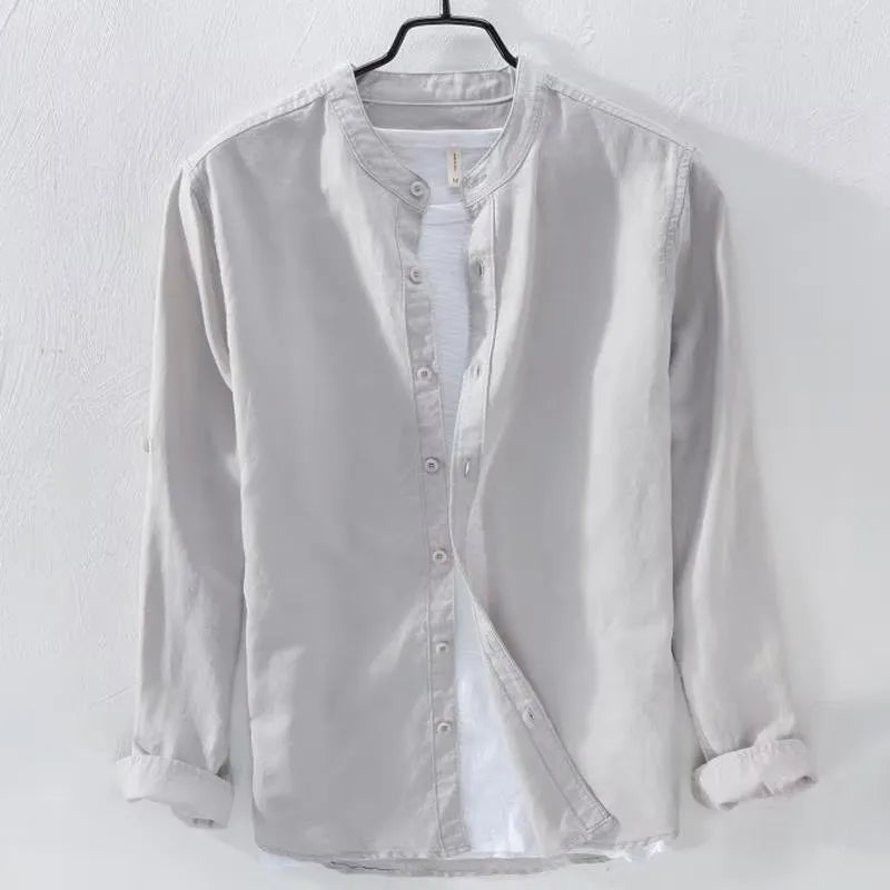 Man wearing a loose fit light blue linen cotton long sleeve casual shirt