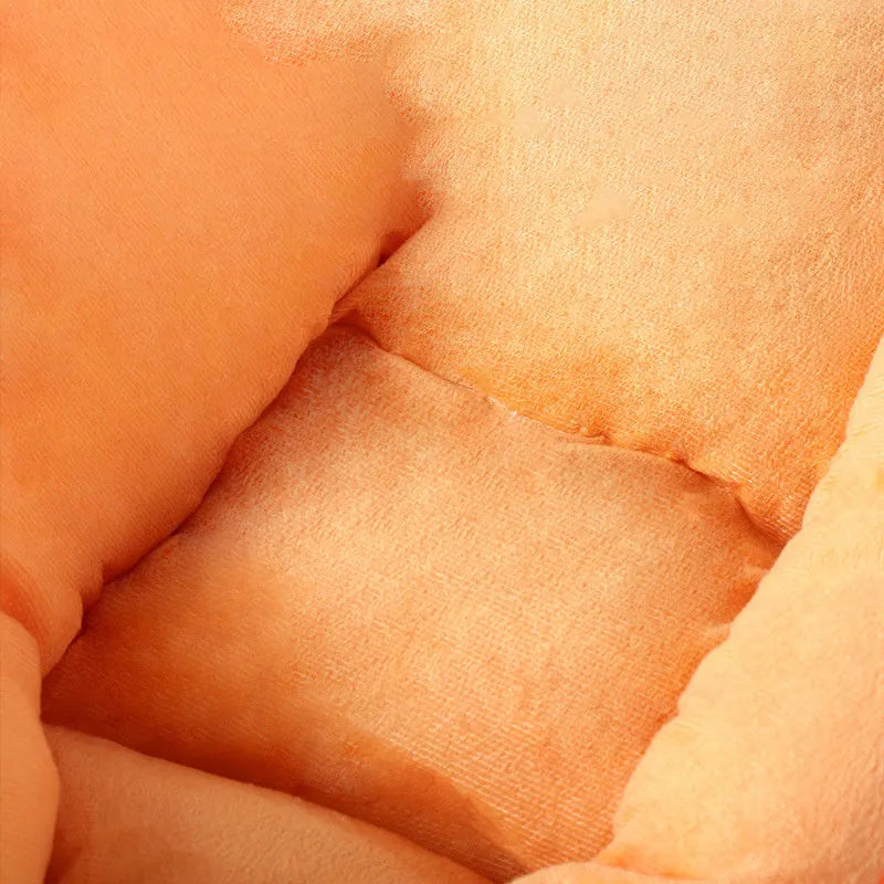 Carrot-shaped plush dog nesting bed with a soft blanket, shown in M and L sizes.