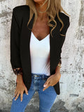 Slim fit black blazer with a raised 3D cheetah print pattern, featuring regular sleeves and a tailored silhouette.