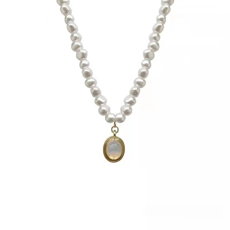 Geometric-shaped alloy necklace on a model, showing its adjustable chain length.