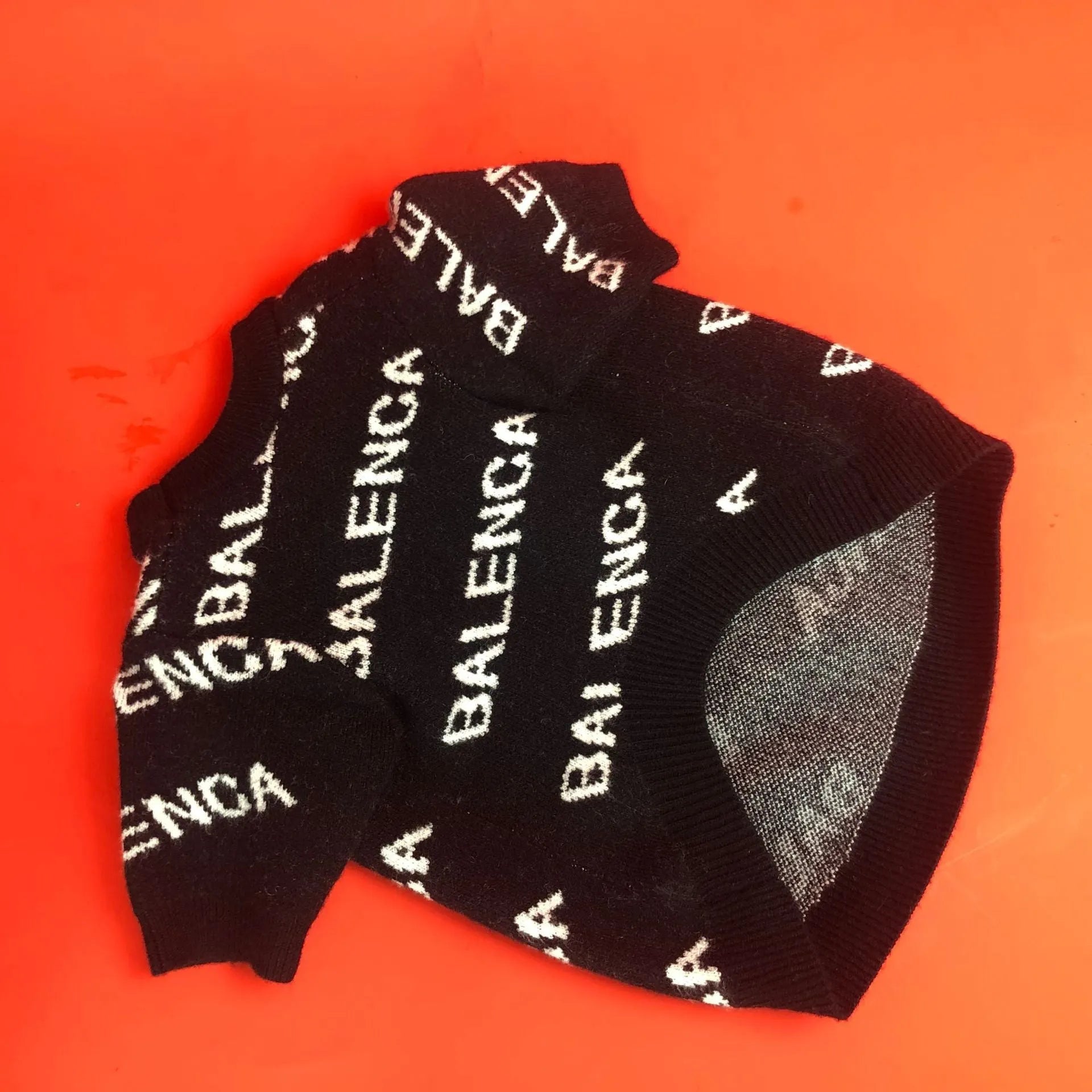 Black acrylic knit dog pullover sweater for small to large dogs, shown on a Schnauzer