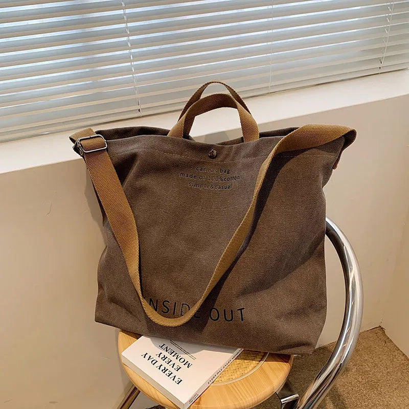 Large-capacity canvas tote bag with alphabet print and adjustable strap in coffee colour