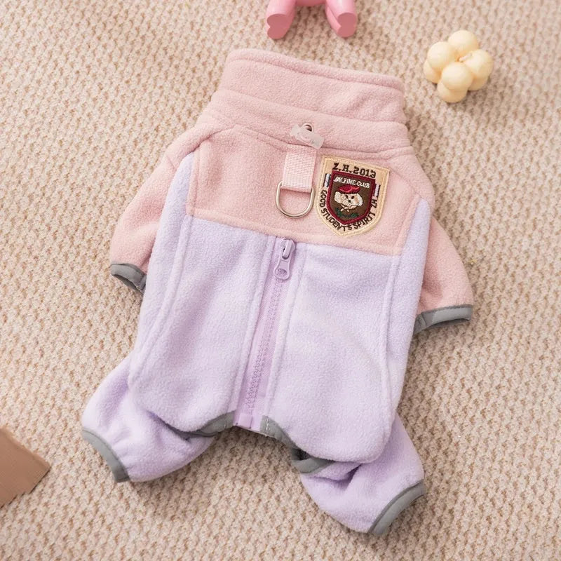 Four-legged fleece pet jacket in colour block design with full zipper and badge patch, sizes S-XXL for cats and small dogs.