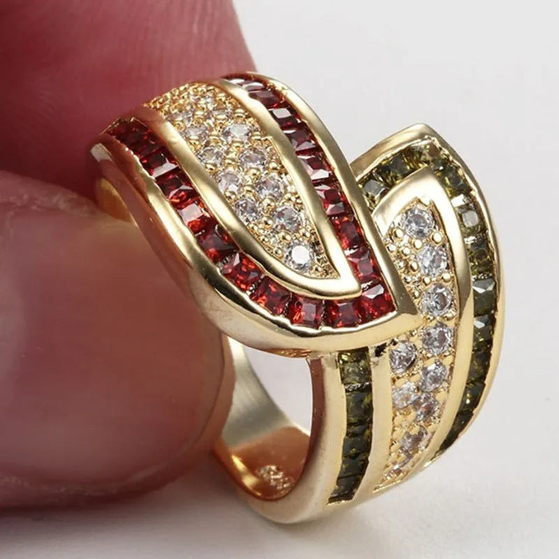 Gold-coloured peridot fashion ring for women on a white background.