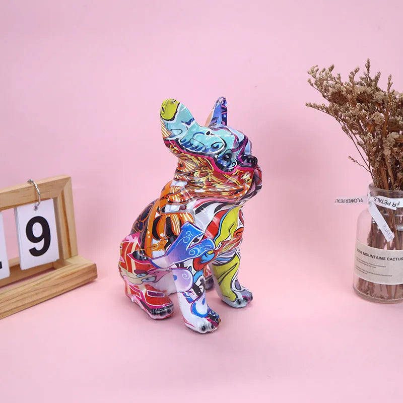 Graffiti finish resin French bulldog statue measuring 17cm in height on display surface