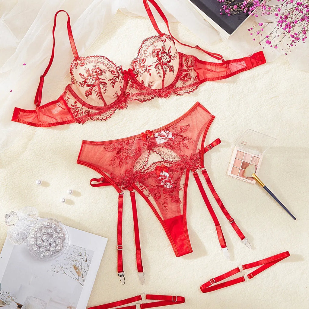 Women's sheer embroidered underwear set with cutouts and a detachable lace-up garter belt in three colour options.