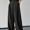 Black men's casual trousers with vertical striped pleats and an elasticated waistband