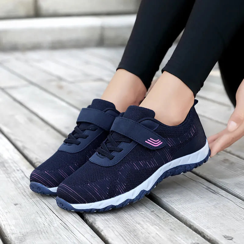 Women's grey purple low-top wedge heel shoes with Velcro strap and round toe.