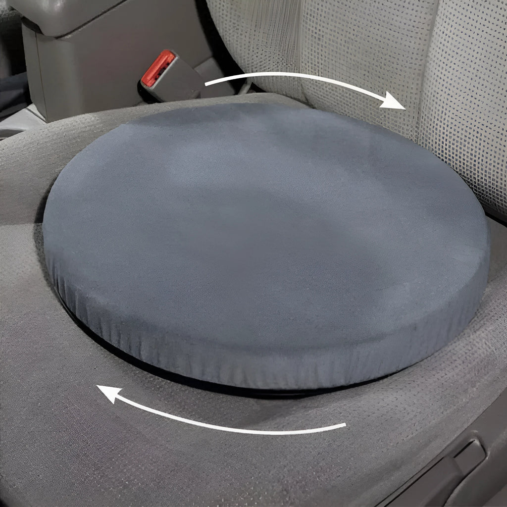Grey rotating car seat cushion with a non-slip base on a car seat.